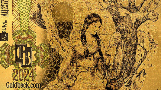 Close-up of Goldback front artwork showing fine engraved line detail in 24-carat gold
