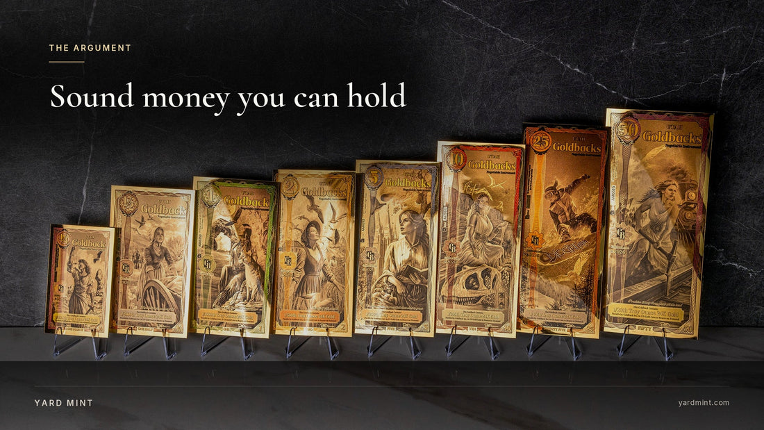 Photograph of the full Utah Goldback series from the quarter to the 50 standing on display stands against dark marble